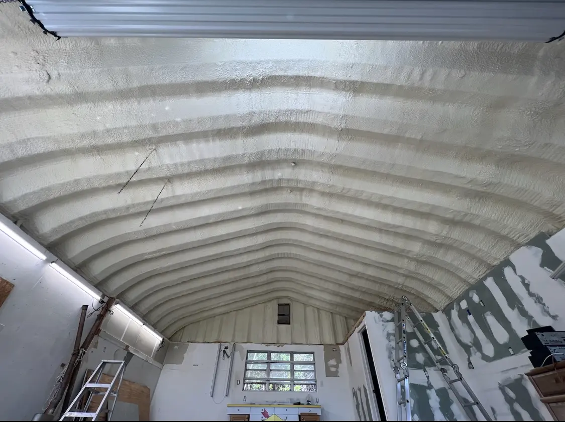 Spray polyurethane foam applied to the underside of a metal roof deck in Chandler